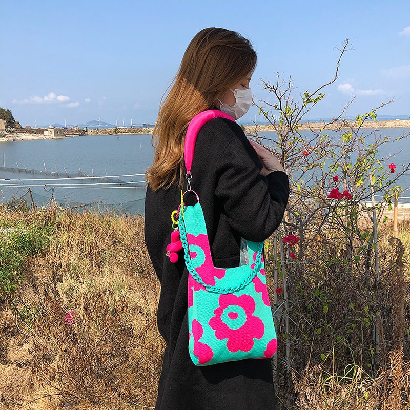 women's pink and green shoulderbag